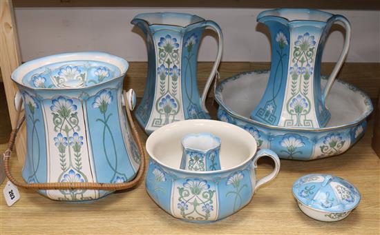 Ford & Sons, Crownford, Burslem, an eight-piece toilet set decorated with stylised cornflowers Jugs H.33cm